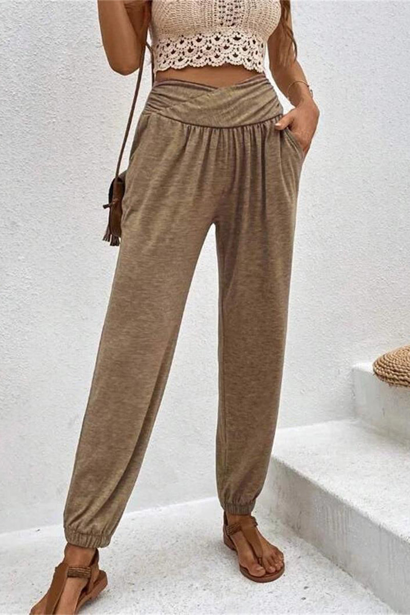 Pantalones casuales de color liso con bolsillo liso y cintura alta holgados