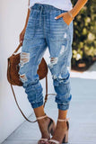 Jeans soltos rasgados com cintura ajustável